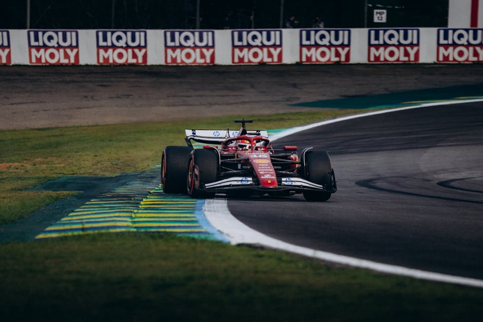 High-speed Formula 1 racing at Interlagos Circuit, São Paulo, Brazil.